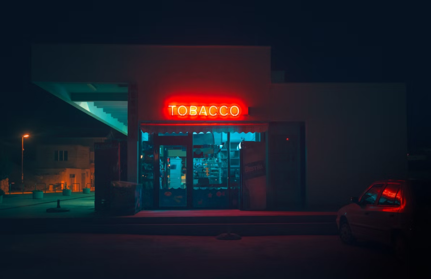 A neon sign that says Tobacco outside of a tobacco-selling shop.