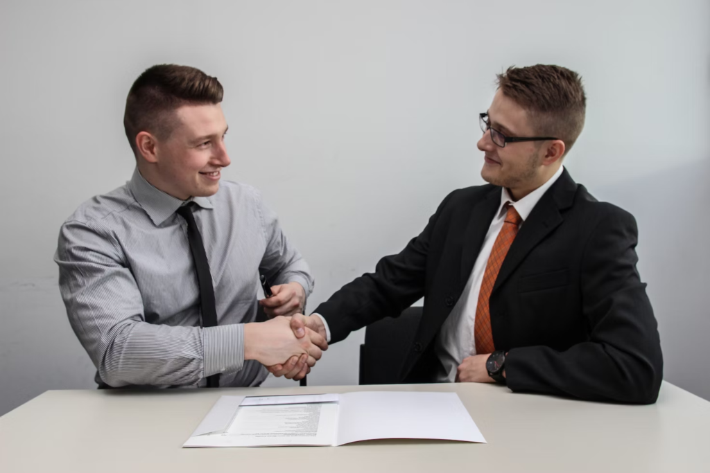 2 males shaking hands