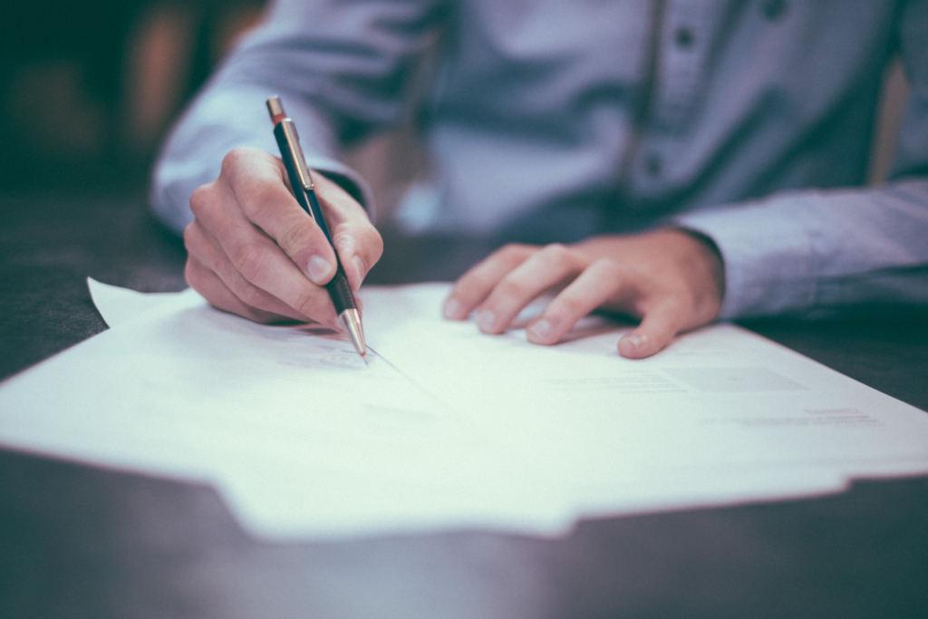 Man writing on a document