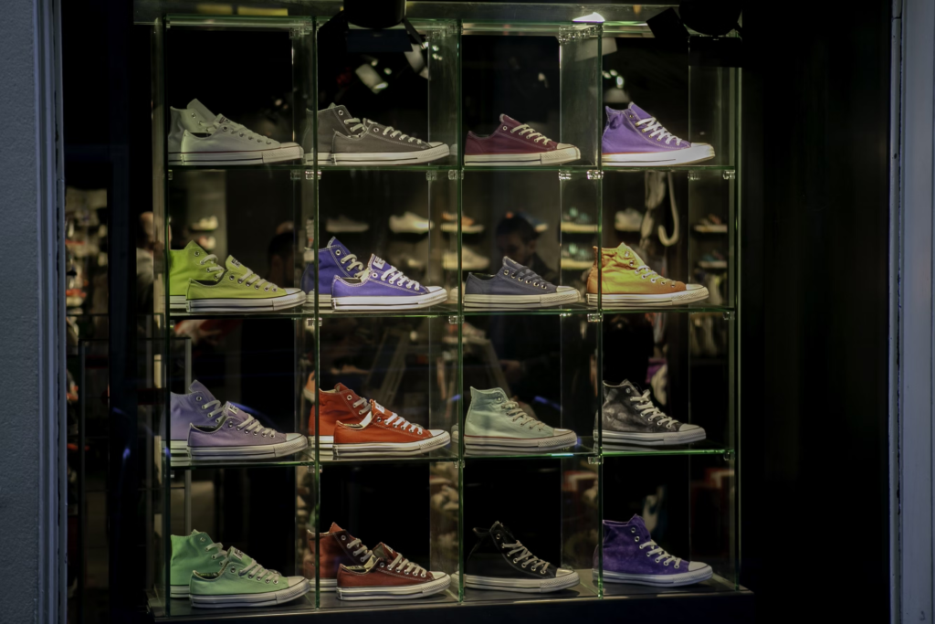 Chuck Taylor All-Stars shoes in different colors on display at a new shoe store