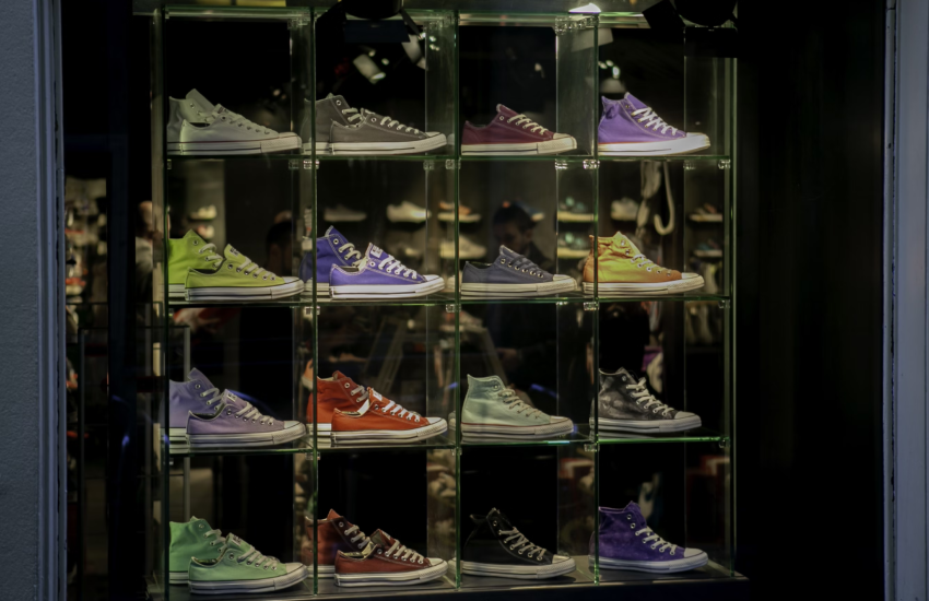 Chuck Taylor All-Stars shoes in different colors on display at a new shoe store