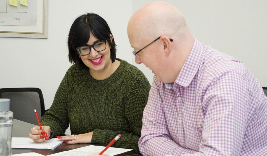 PR professionals reviewing a company's boilerplate for a press release.