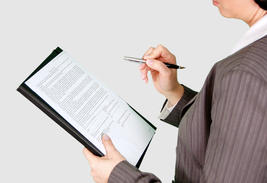 A person writing relevant credentials in a press release bio.