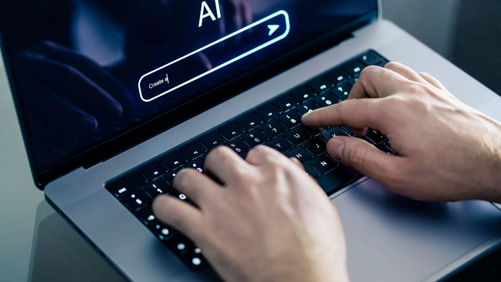 Hands typing an AI press release prompt into a glowing chat interface on a laptop screen